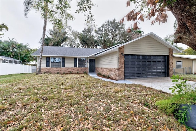 single story home with a front yard and a garage