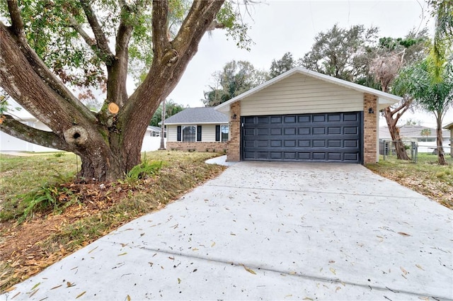 ranch-style home featuring a garage