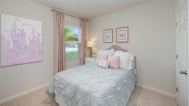 carpeted bedroom with baseboards