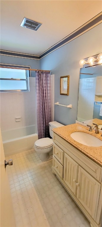 full bathroom with vanity, shower / bath combo with shower curtain, and toilet