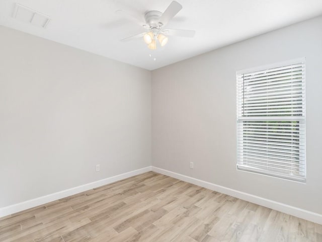 unfurnished room with ceiling fan and light hardwood / wood-style flooring