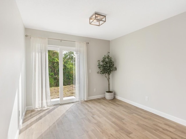 spare room featuring light hardwood / wood-style flooring