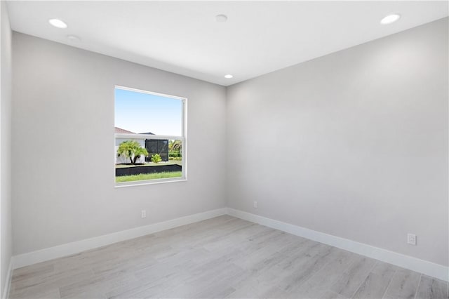 spare room featuring light hardwood / wood-style flooring