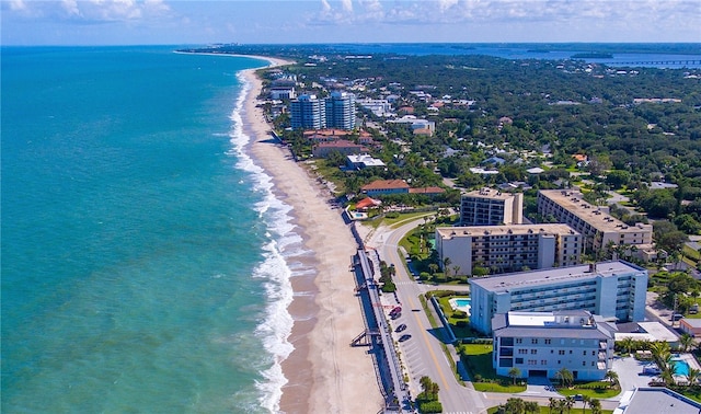 bird's eye view with a beach view and a water view