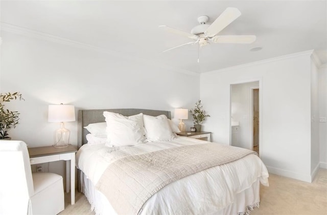 carpeted bedroom featuring ceiling fan and ornamental molding