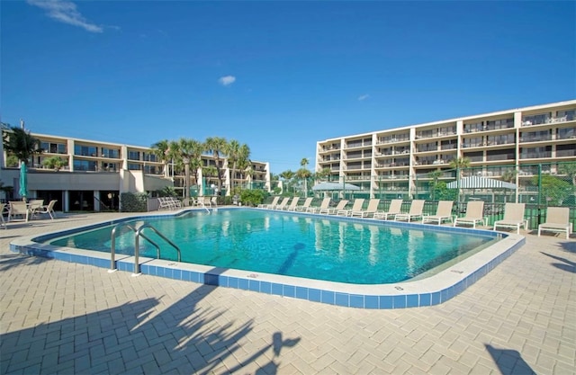 view of swimming pool featuring a patio