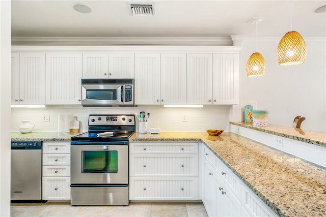 kitchen with stainless steel appliances, decorative backsplash, ornamental molding, white cabinetry, and decorative light fixtures