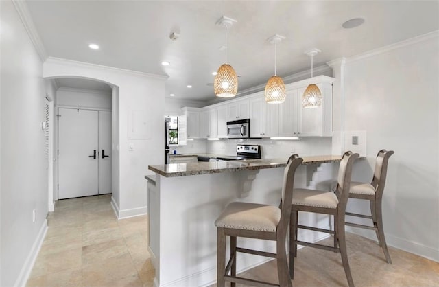 kitchen with white cabinetry, kitchen peninsula, dark stone countertops, decorative light fixtures, and electric stove