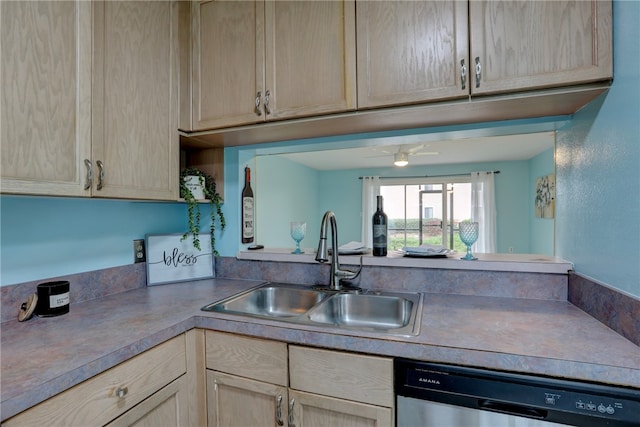 kitchen with light brown cabinetry, stainless steel dishwasher, and sink