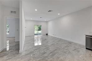 unfurnished living room with baseboards, visible vents, and recessed lighting