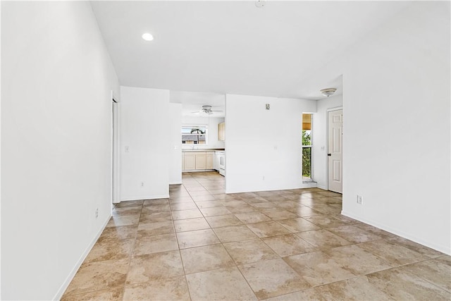 unfurnished living room with ceiling fan