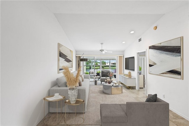 living room with ceiling fan and lofted ceiling