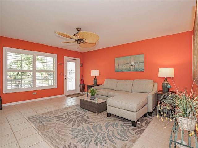 tiled living room featuring ceiling fan