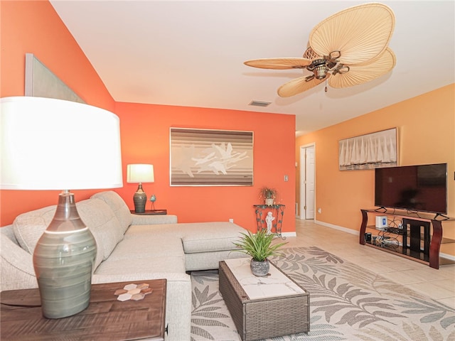 tiled living room featuring ceiling fan