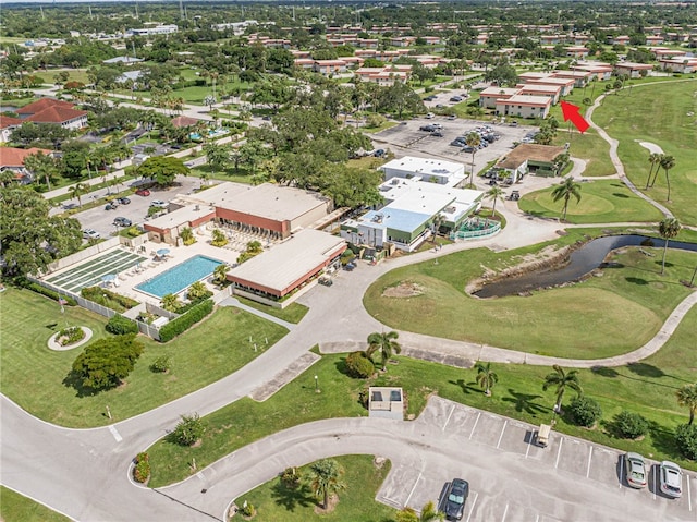 55 Woodland Dr Unit 206, Vero Beach, FL 32962 - aerial view of property and surrounding area with a pool area and a local golf course