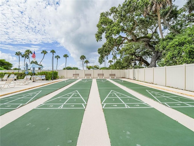 55 Woodland Dr Unit 206, Vero Beach, FL 32962 - view of community featuring fence and shuffleboard