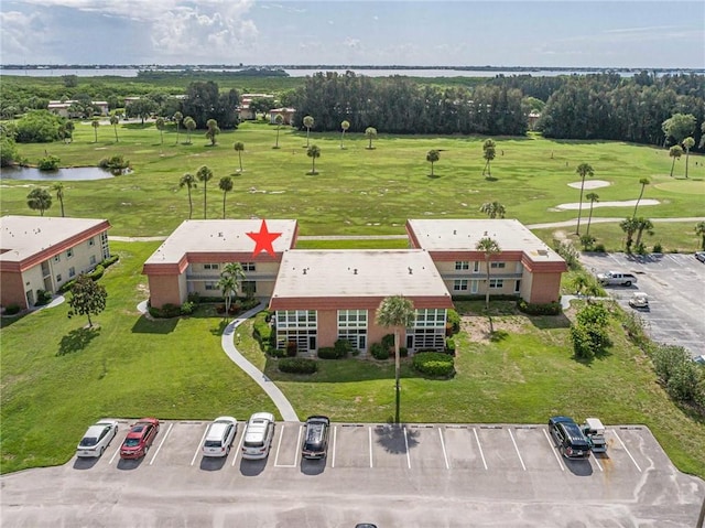 55 Woodland Dr Unit 206, Vero Beach, FL 32962 - bird's eye view of a golf course and a large body of water