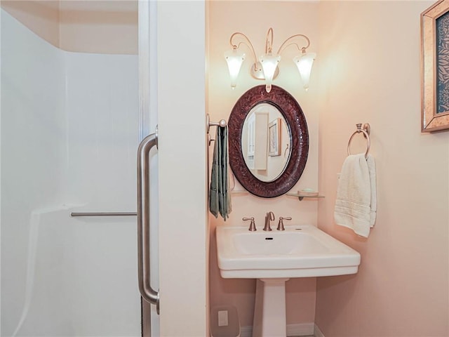 55 Woodland Dr Unit 206, Vero Beach, FL 32962 - bathroom featuring a shower with shower door