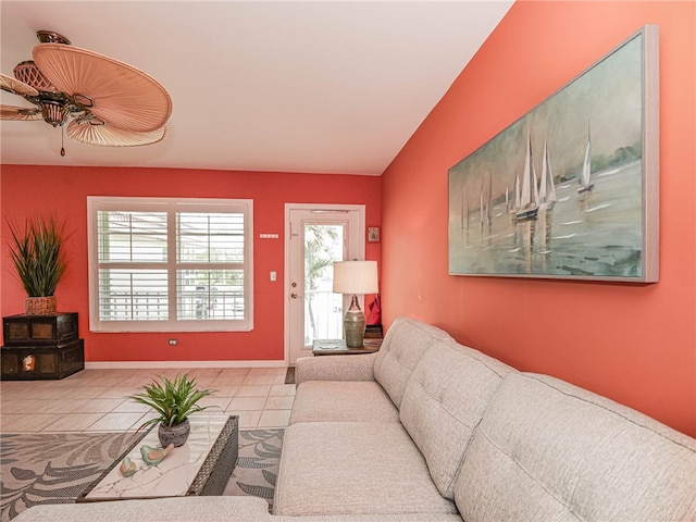 tiled living room featuring ceiling fan