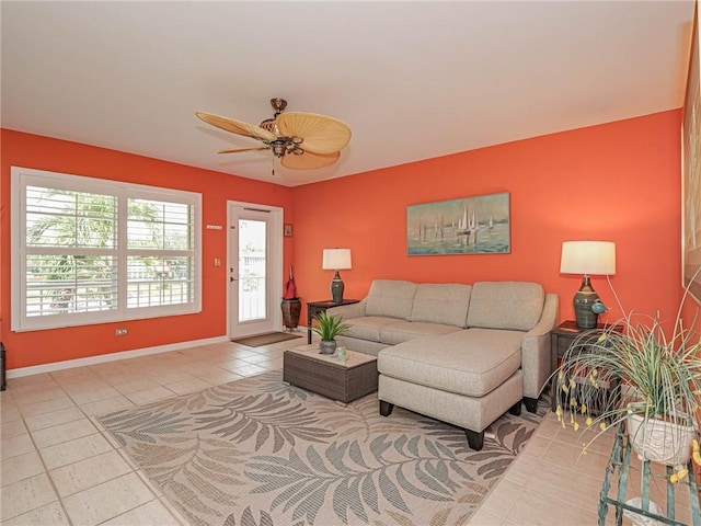 55 Woodland Dr Unit 206, Vero Beach, FL 32962 - living area with light tile patterned floors, a ceiling fan, and baseboards