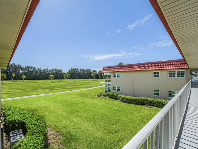 view of yard with a balcony