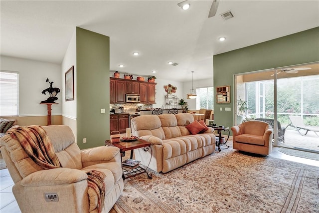 living room featuring a ceiling fan, recessed lighting, and visible vents