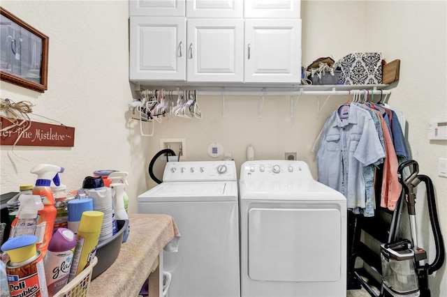 laundry area with washer and dryer and cabinet space