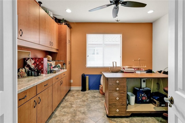 kitchen featuring ceiling fan, baseboards, light countertops, and recessed lighting