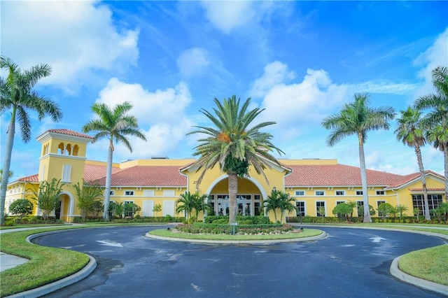 view of building exterior featuring curved driveway