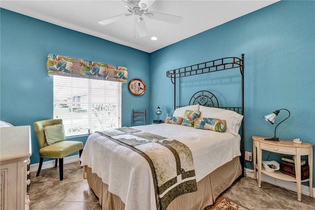 bedroom with baseboards and a ceiling fan