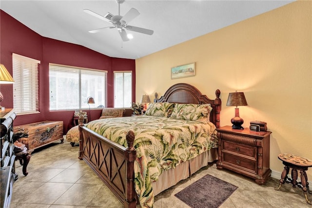 bedroom featuring a ceiling fan, vaulted ceiling, and light tile patterned floors