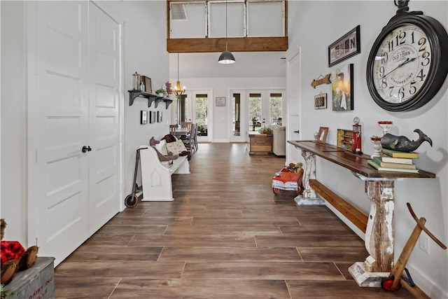 foyer entrance featuring french doors and an inviting chandelier