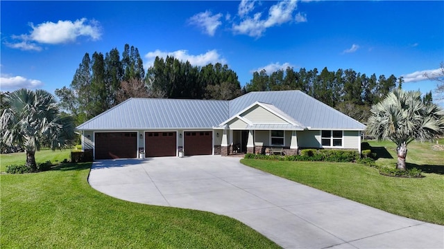 view of front facade featuring a front yard and a garage