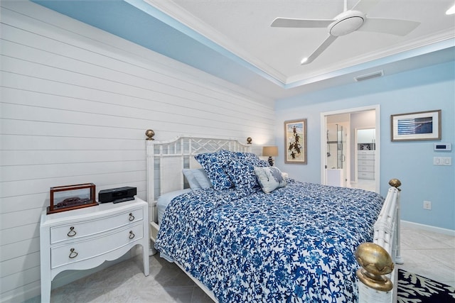 tiled bedroom featuring ceiling fan and crown molding