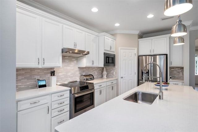 kitchen with tasteful backsplash, white cabinetry, decorative light fixtures, and appliances with stainless steel finishes