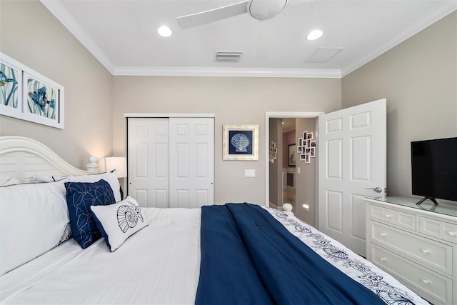 bedroom featuring ceiling fan, a closet, and ornamental molding