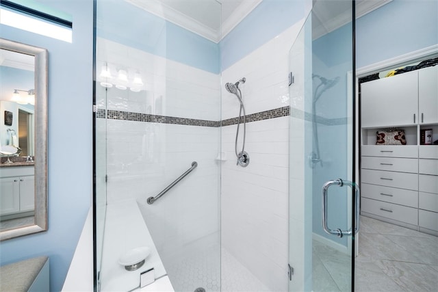 bathroom with crown molding, vanity, and an enclosed shower