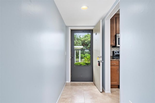 doorway featuring light tile patterned floors