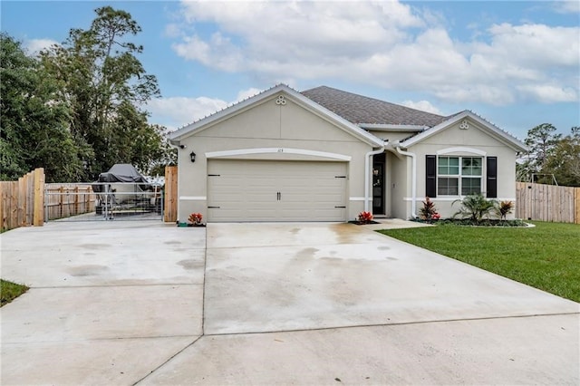 ranch-style home with a front lawn and a garage