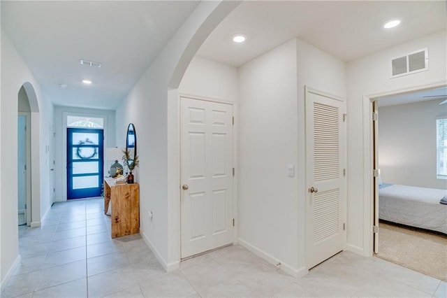 hallway with light tile patterned flooring