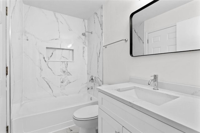 full bathroom featuring vanity, toilet, and tiled shower / bath