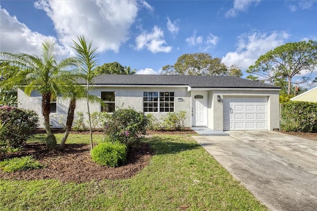 ranch-style home with a front lawn and a garage