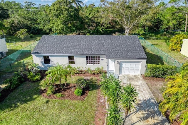 view of front of house featuring a front yard and a garage