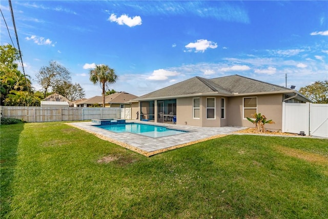 view of pool with a yard and a patio area