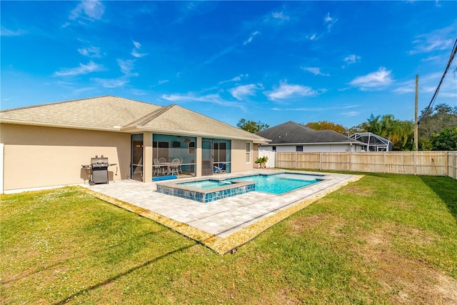 view of swimming pool with a patio area, grilling area, a yard, an in ground hot tub, and a sunroom