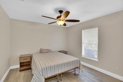 bedroom featuring ceiling fan and light wood-type flooring