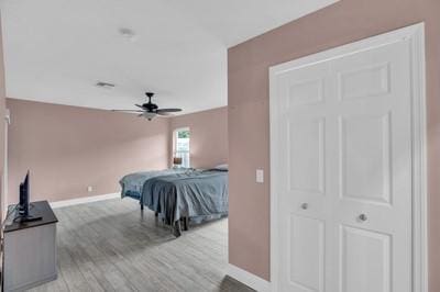 bedroom featuring ceiling fan and light hardwood / wood-style floors