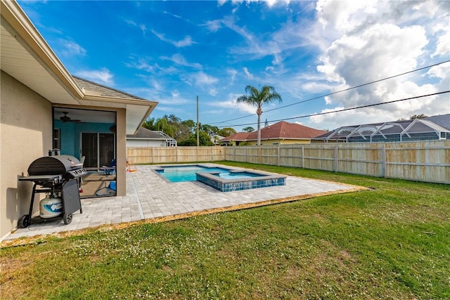 view of swimming pool with a grill, a yard, a patio, and an in ground hot tub