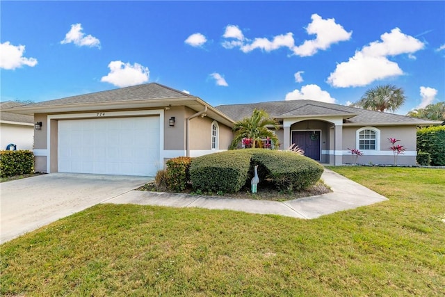 ranch-style house featuring a garage and a front lawn