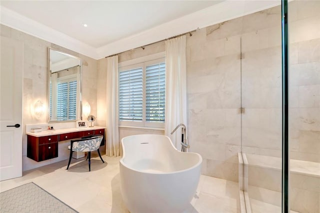 707 Grove Pl, Vero Beach, FL 32963 - bathroom with a freestanding tub, double vanity, tiled shower, and tile patterned floors